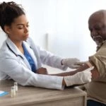 Woman receiving flu vaccine - Precision Clinical Research
